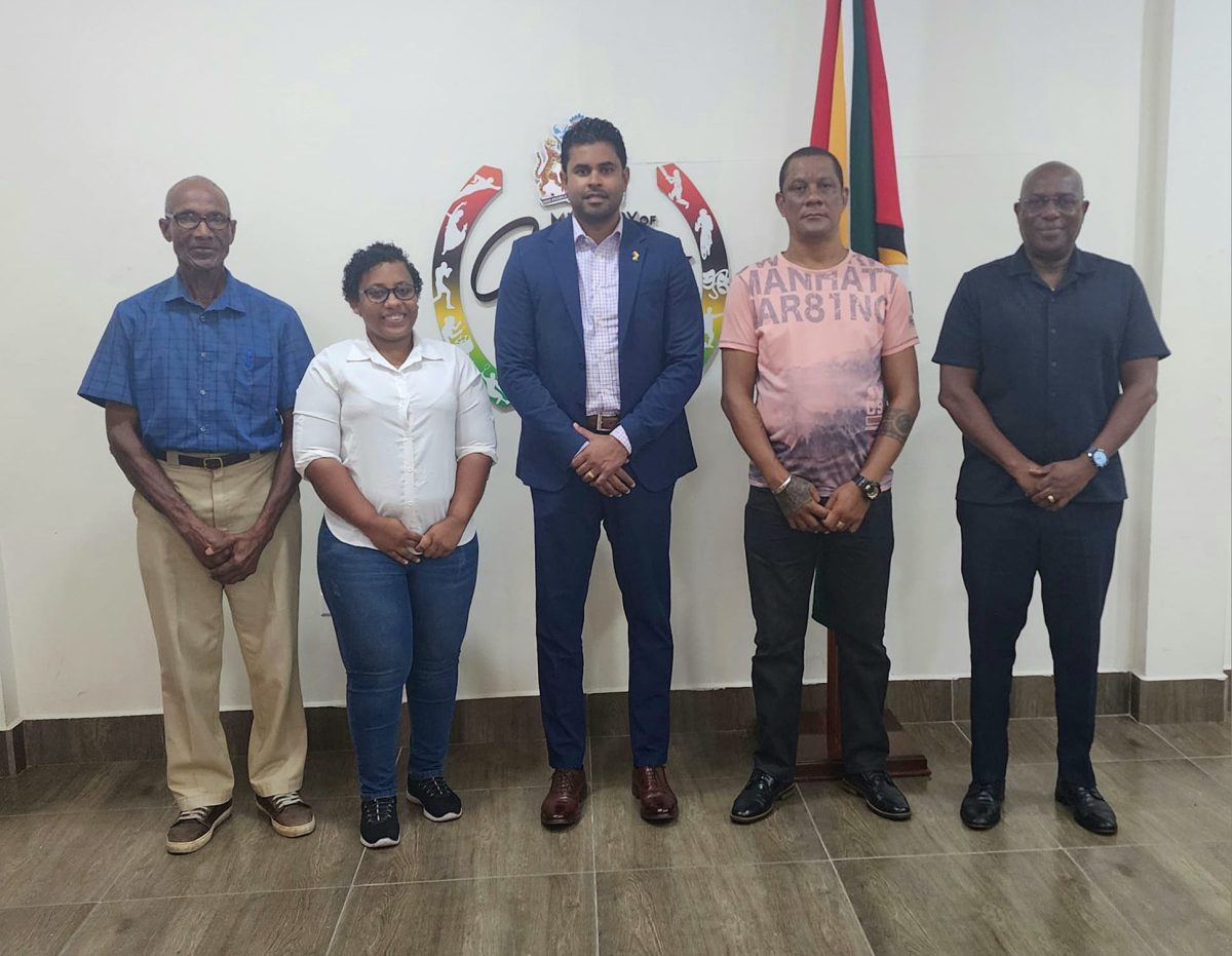 Officials of the GCF pose for a photo opportunity with the Minister of Culture, Youth & Sport, Charles Ramson Jr. (centre) and Director of Sport, Steve Ninvalle (right)
