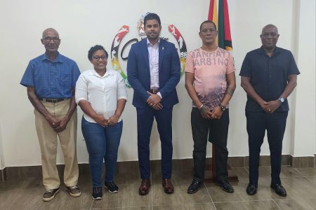 Officials of the GCF pose for a photo opportunity with the Minister of Culture, Youth & Sport, Charles Ramson Jr. (centre) and Director of Sport, Steve Ninvalle (right)
