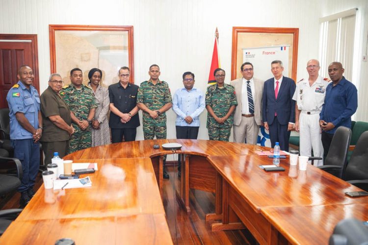 Dr Ashni Singh (centre) and other officials, inclusive of Chief of Staff Omar Khan and Presidential Advisor for Security Gerry Gouvia, at yesterday’s signing
