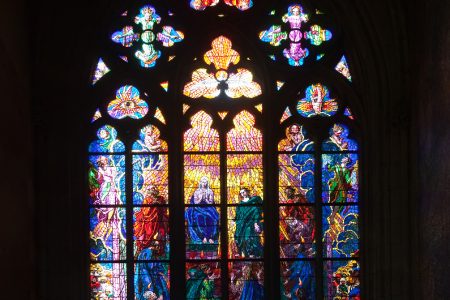 Stained-glass window in Saint Vitus Cathedral; stained-glass windows frequently appear in places of worship and usually depict a scene regarded as holy (Image by bearfotos on Freepik)