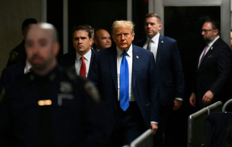 Former U.S. president and Republican presidential candidate Donald Trump arrives at Manhattan Criminal Court to attend his trial for allegedly covering up hush money payments linked to extramarital affairs in New York, U.S., April 22, 2024. ANGELA WEISS/Pool via REUTERS