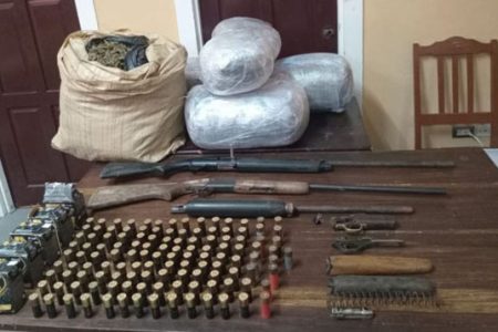 The cannabis, guns, and ammo discovered during the eradication exercise