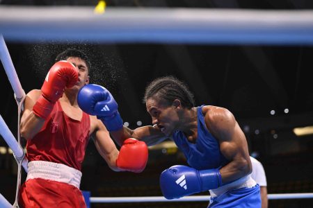 Keevin Allicock (right), who defeated Guatemala’s Jose Filipe in the earlier round, suffered a majority decision loss to Turkey’s Batuhan Ciftci at the round of 32 yesterday in Bangkok, Thailand
