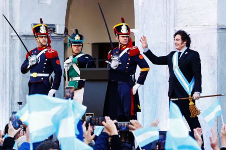 Argentina’s President Javier Milei waves to supporters outside the Cabildo during the commemoration of the 214th anniversary of the May Revolution, in Cordoba, Argentina May 25, 2024.