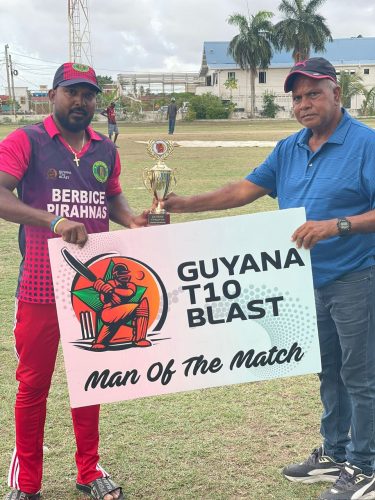 Berbice Piranhas captain Veerasammy Permaul (right) collects his man-of-the-match accolade after snaring 4-24