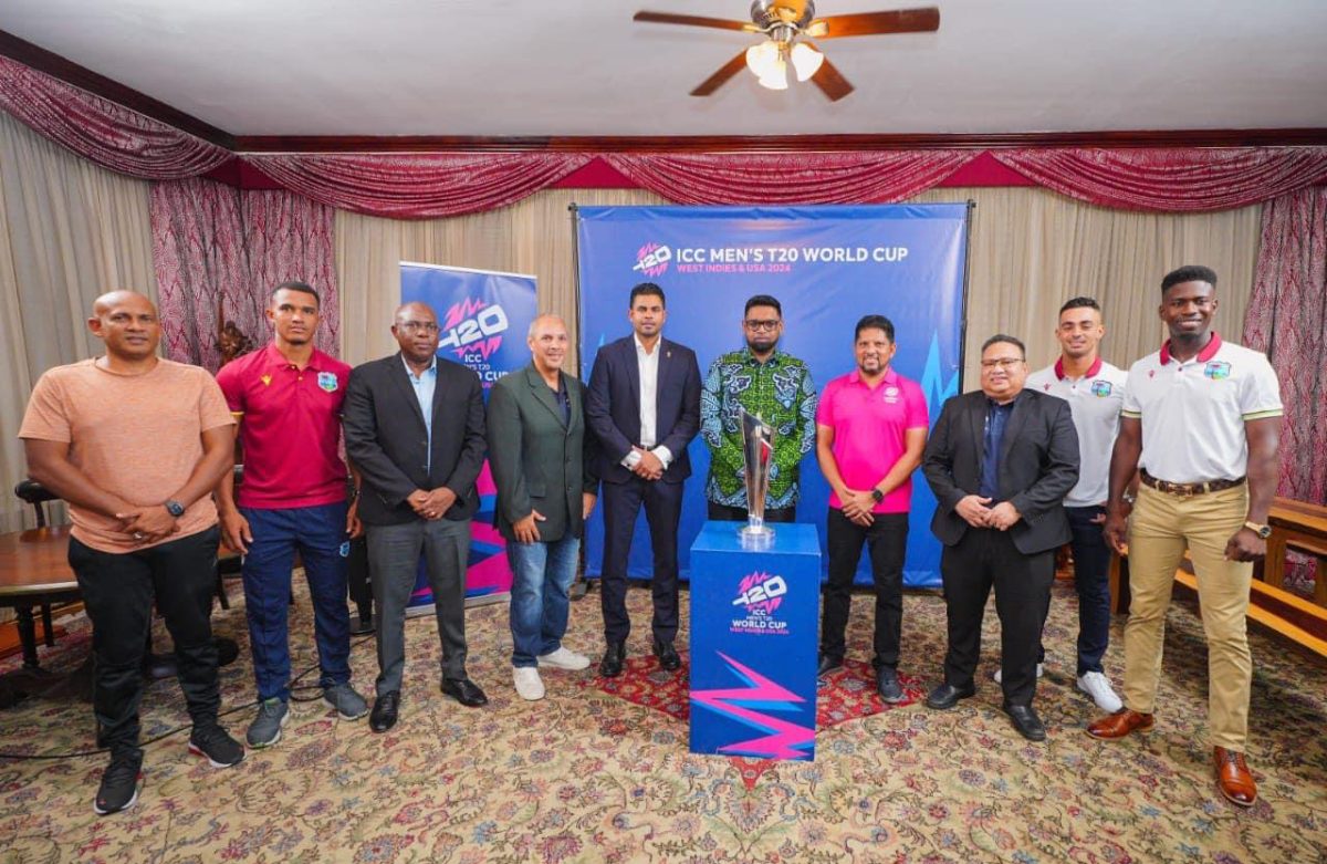 President Dr. Irfaan Ali (centre) last evening hosted the ICC Men’s T20 World Cup trophy at State House. He was joined by the ICC T20 World Cup’s Head of PR and Communications, Damon Leon (4th from left), Minister of Culture, Youth, and Sport, Charles Ramson Jr. (5th from left), Director of Sport Steve Ninvalle (3rd from left), former cricketer Ramnaresh Sarwan (4th from right), and current West Indies players, Tevin Imlach (2nd from left), Kevin Sinclair (1st from right), and Tagenarine Chanderpaul (2nd from right).
