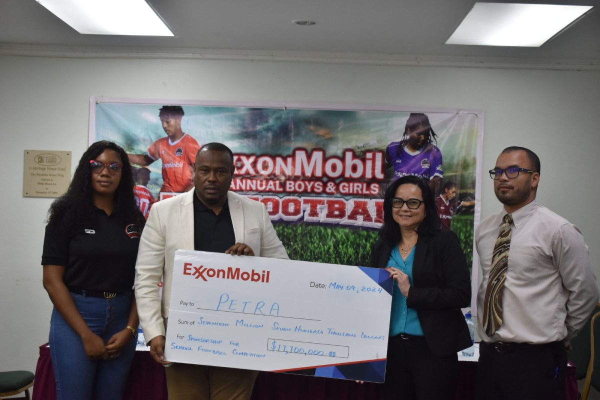 Petra Organisation’s Co-Director Troy Mendonca (2nd from left) receives the sponsorship
cheque from ExxonMobil’s Community Relations Manager Suzanne DeAbreu while a
Petra representative (left) and Allied Arts Unit Head, Nicholas Fraser, looks on