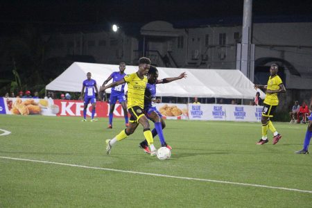 GPF’s Dorwin George (right) tussles with Rondell Peters of Western Tigers for possession
