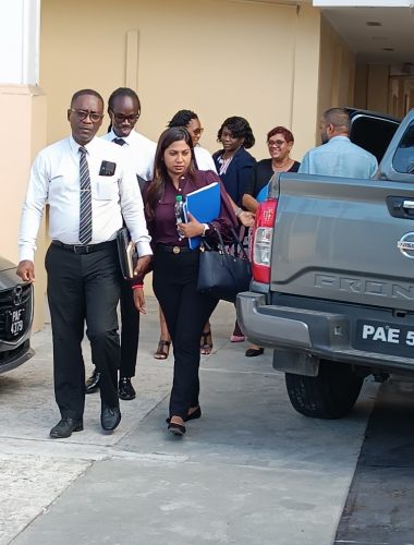 Executive members of the GTU and Ministry of Education officials as they made their way out of the meeting yesterday.