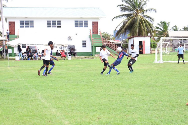 Part of the action in the ExxonMobil Boy’s and Girl’s U-14 Football Championship qualifiers at the Ministry of Education ground, Carifesta Avenue