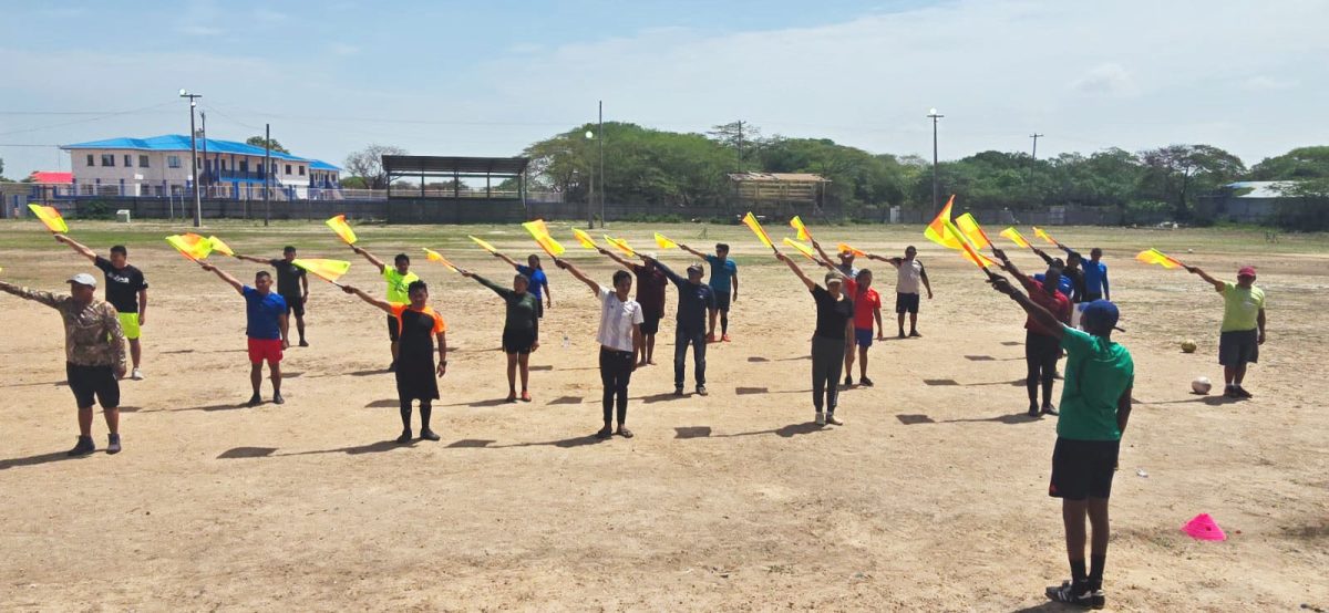 Participants in the GFF Referee Introductory Course are attempting a practical drill under the guidance of instructor Sherwin Johnson