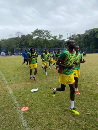 Members of the Golden Jaguars team going through their warmup routine ahead of a training session in Brazil.