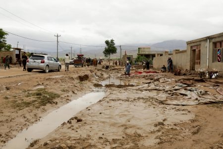 People clear damages caused in the aftermath of floods following heavy rain, in Sheikh Jalal District, Baghlan province, Afghanistan May 11, 2024. REUTERS/Sayed Hassib