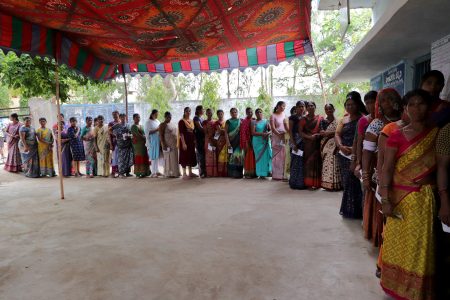 Women stand in a line to cast their votes at a polling station during the fourth phase of India's general election in Rangareddy district in the southern state of Telangana, India, May 13, 2024. REUTERS/Almaas Masood