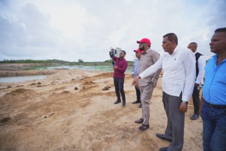 President Irfaan Ali (third from right) examining the ponds on the land (DPI photo)