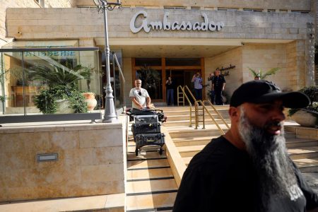 A man maneuvers media equipment following an Israeli police raid on Al Jazeera’s de facto office at the Ambassador Hotel in Jerusalem, May 5, 2024.