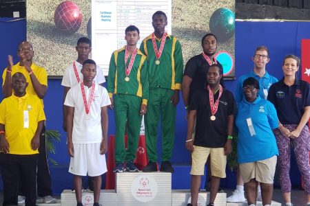 The team of Keston Knights and Daniel Samsundar stands
atop the podium following their triumph in the doubles division