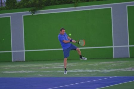 Robert Edwards returns a ball
during a rally against Nygel Sundar