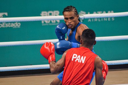 Keevin Allicock (in background) during his round of 64 bout on
Friday last in Bangkok, Thailand. Today he will face Turkish
boxer Batuhan Ciftci in a round of 32 clash