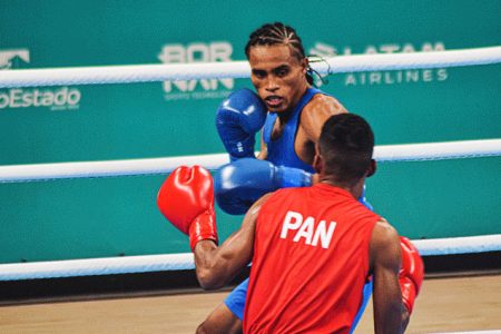 Keevin ‘Lightning’ Allicock (background) booked a spot in the round of 32 at the Olympic Qualifier tournament in Bangkok, Thailand with a third round stoppage of Guatemala’s Jose Filipe in round 3 of their round of 64 bout.
