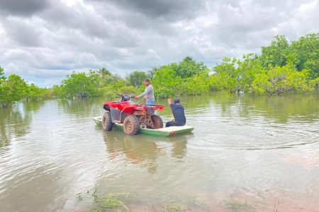 An ATV on a boat amid the Region Nine floodwater (Region Nine Facebook page)
