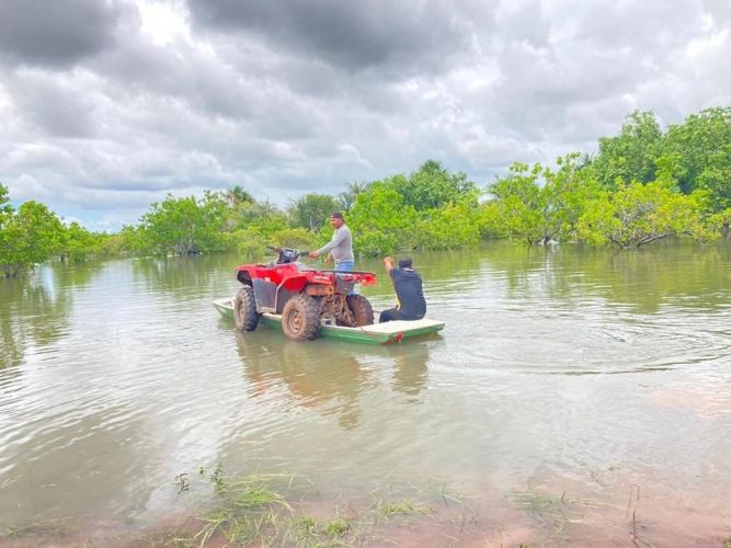An ATV on a boat amid the Region Nine floodwater (Region Nine Facebook page)
