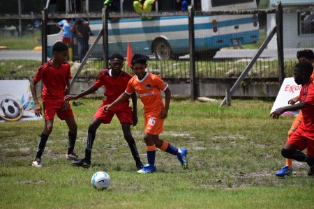 Defending champions Bartica Secondary (in orange) got off to a
positive start with a 3-0 win over L’Aventure Secondary. 
