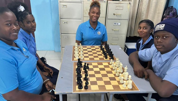The Guyana Chess Federation Special Needs Committee hosted a training session for teachers and students from eight special needs schools recently. The idea is to expose the children to the merits of playing chess. In photo are students of the Linden School for Special Children and their teacher.