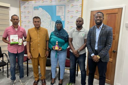 Chief Investment Officer, Dr Peter Ramsaroop is second from left.  Senior Director of Investment, John Edghill is at right. Sandra Craig of SS Natural Fruit Flavor is at centre and at left is Precision Global Vice President Lesley Ramlall.