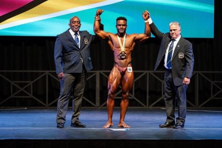 Nicholas Albert poses with his title after
winning the 90kg class and the overall title. 