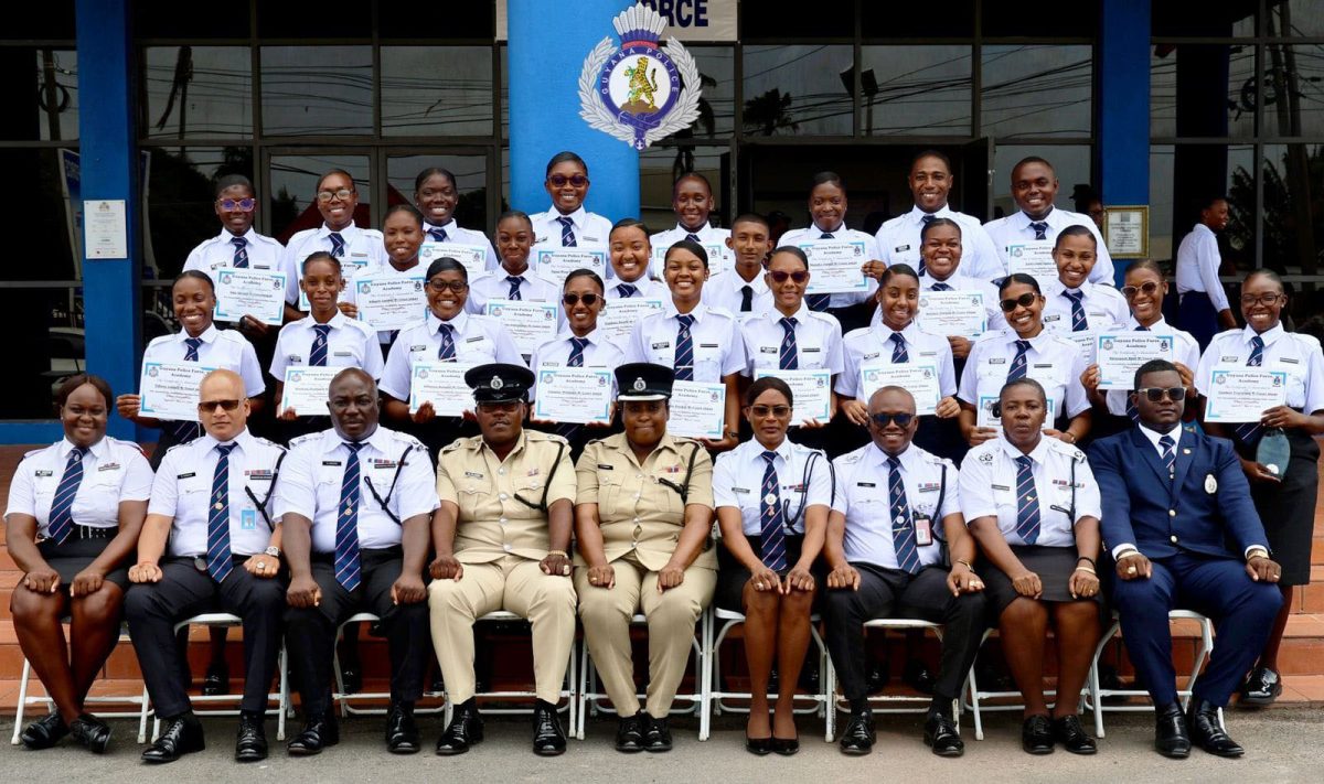 The new constables with senior members of the police force (GPF photo)