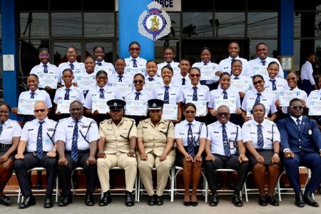 The new constables with senior members of the police force (GPF photo)