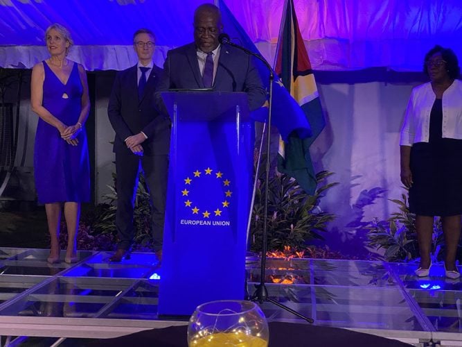 Prime Minister Mark Phillips speaking at last night’s reception. Second from left is, EU Ambassador to Guyana René van Nes. At right is the Prime Minister’s wife, Mignon Phillips.  At left is the Ambassador’s wife, Jeanette van Nes. 