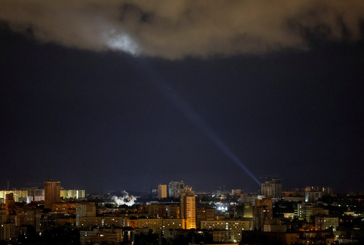 Ukrainian servicemen use a searchlight as they search for drones in the sky over the city during a Russian drone and missile strike in Kyiv, Ukraine May 8, 2024. REUTERS/Gleb Garanich