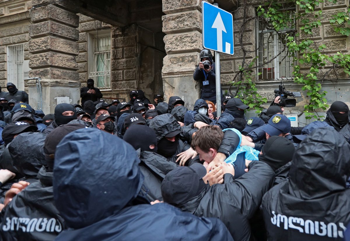 Law enforcement officers detain a demonstrator during a rally to protest against a bill on "foreign agents" in Tbilisi, Georgia, May 14, 2024. REUTERS/Irakli Gedenidze