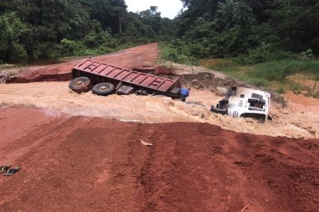 The destroyed section of the corridor with the truck after it toppled.  (Ministry of Public Works photo)