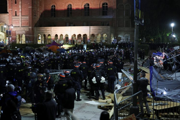 Law enforcement officers stand guard at the University of California Los Angeles (UCLA), during a pro-Palestinian protest, as the conflict between Israel and the Palestinian Islamist group Hamas continues, in Los Angeles, California, U.S., May 2, 2024. REUTERS/Mike Blake