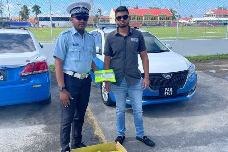 In an effort to significantly improve traffic management and road safety, businessman Ranesh Bhookmohan (right), owner of TSR Construction, donated 100 reflector vests to the Guyana Police Force (GPF) Traffic Department.
Traffic Sergeants Harold Devira, Richard Trotz, and Constable Edwin Connelly received the vests at Traffic Headquarters, Eve Leary, a release from the police said yesterday.  (GPF photo)
