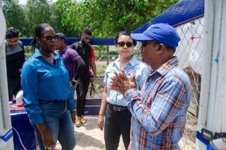 Vice Chairman Humace Oodit (right) and Minister within the Ministry of Housing and Water Susan Rodrigues (centre) interacting with a resident of the Pomeroon River (DPI photo)