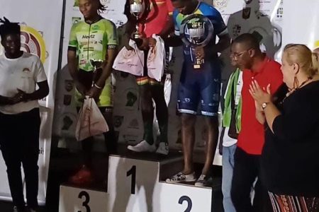 Guyana’s Briton John stands atop the
podium after winning the first stage of the Grand Prix L’Ouest Guyanais in Suriname