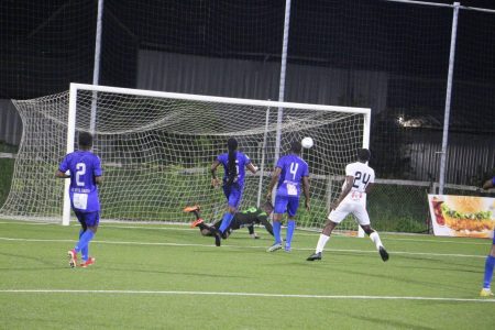 Ian Daniels (no.24) of Santos scores the second goal against Anns Grove with a powerful shot into the right corner