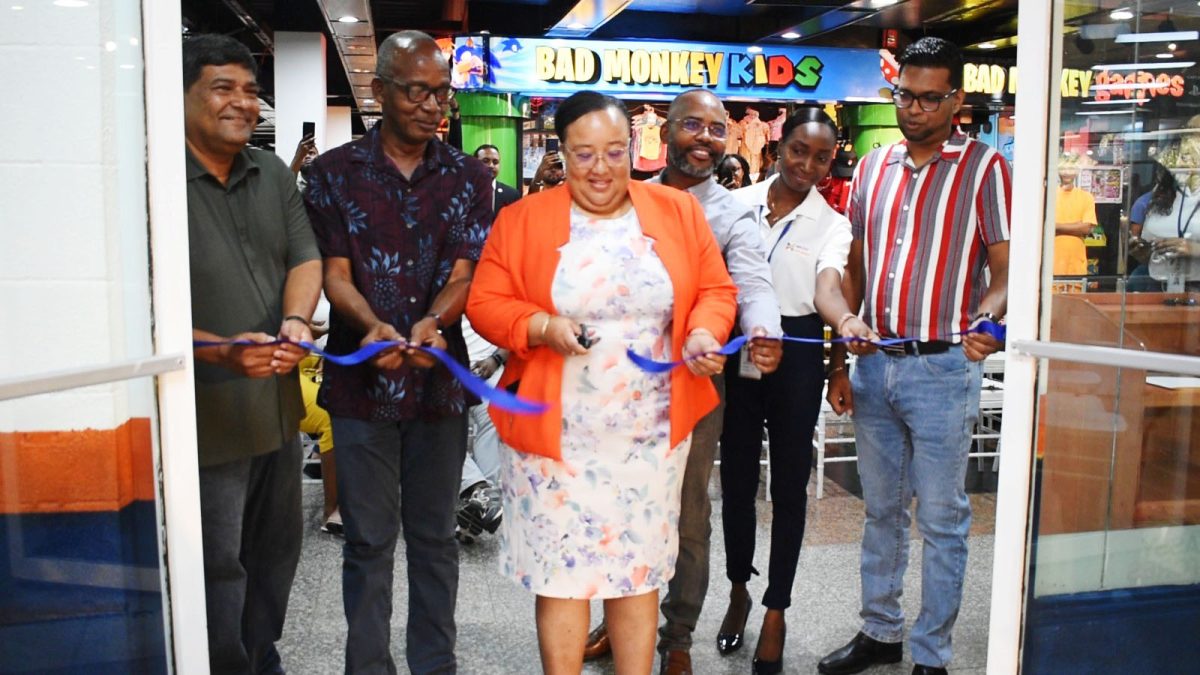 Branch Manager Elizabeth Mason (centre), Minister of Labour Joseph Hamilton (second from left), General Manager Robert Singh (left) and CEO Devindra Deonarine at the ribbon cutting.