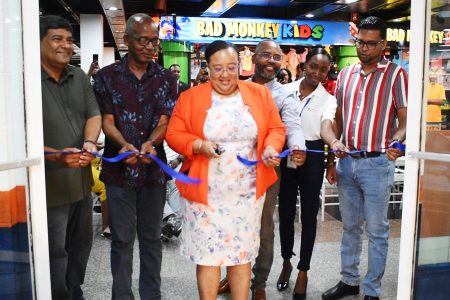 Branch Manager Elizabeth Mason (centre), Minister of Labour Joseph Hamilton (second from left), General Manager Robert Singh (left) and CEO Devindra Deonarine at the ribbon cutting.
