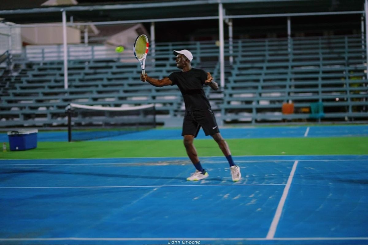 Phillip Squires returns the ball during a rally in the Men’s 35 and Over Doubles section