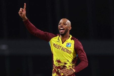 Off-spinner Roston Chase celebrates a wicket against United States on Friday night.