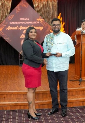 President Irfaan Ali (right) presenting an award. (DPI photo)