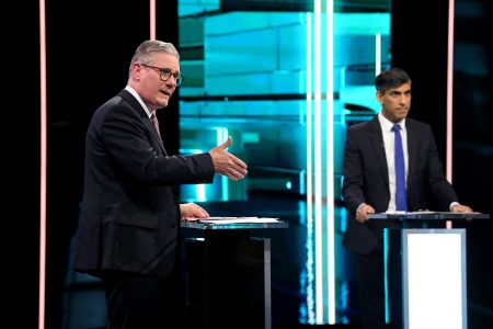 Labour Party leader Keir Starmer and Conservative Party leader and Prime Minister Rishi Sunak debate, as ITV hosts the first head-to-head debate of the General Election, in Manchester, Britain, June 4, 2024 in this handout image. Jonathan Hordle/ITV/Handout via REUTERS