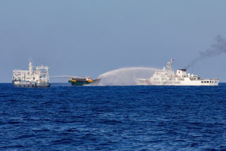 FILE PHOTO: Chinese Coast Guard vessels fire water cannons towards a Philippine resupply vessel Unaizah May 4 on its way to a resupply mission at Second Thomas Shoal in the South China Sea, March 5, 2024. REUTERS/Adrian Portugal/File Photo