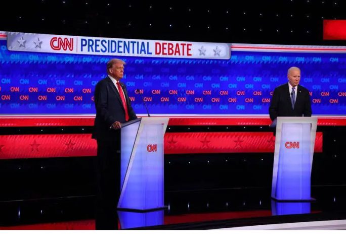 Democrat candidate, U.S. President Joe Biden, and Republican candidate, former U.S. President Donald Trump, stand at their podiums at the start of a presidential debate in Atlanta, Georgia, U.S., June 27, 2024. REUTERS/Brian Snyder