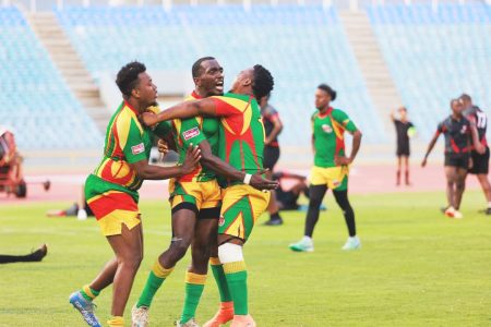 Flashback! Godfrey Pollydore (centre) celebrates with his teammates after their
24-23 win over Trinidad and Tobago at the Haseley Crawford Stadium in Trinidad.
Today the Green Machine will be looking to replicate the feat by a greater margin. 